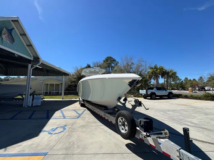  Yacht Photos Pics 2019 Fountain 39 NX boat on trailer in sunny parking lot.