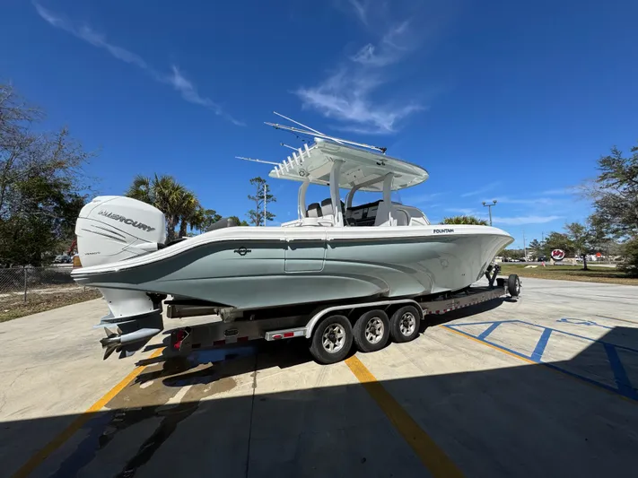  Yacht Photos Pics 2019 Fountain 39 NX boat on trailer under clear blue sky.