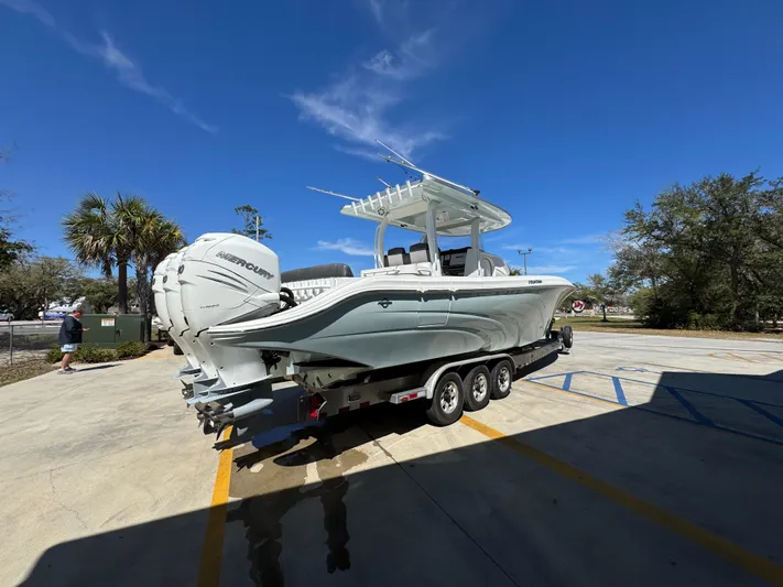  Yacht Photos Pics 2019 Fountain 39 NX boat on trailer under clear blue sky.