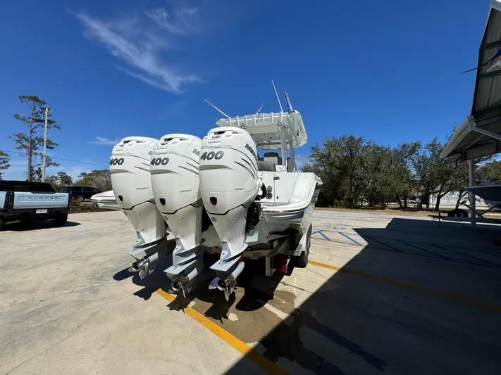  Yacht Photos Pics 2019 Fountain 39 NX boat with triple 400 horsepower engines, parked outdoors.