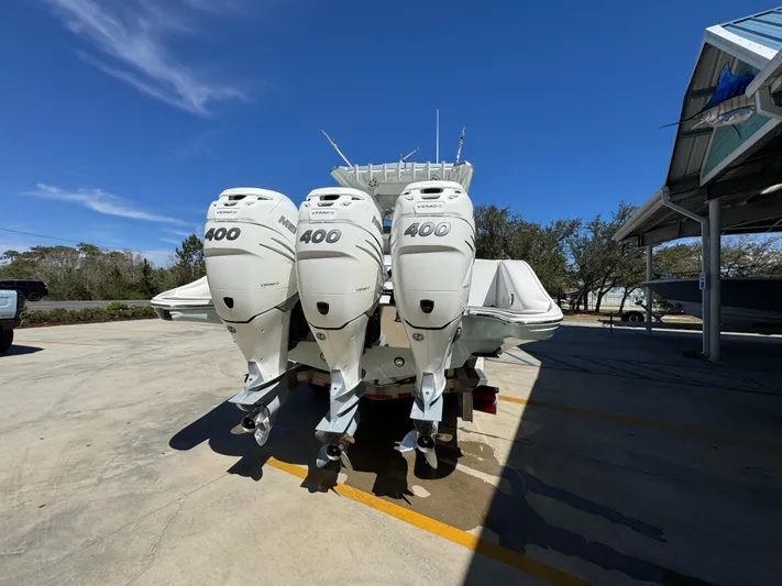  Yacht Photos Pics 2019 Fountain 39 NX boat with triple 400 horsepower engines, parked outdoors.