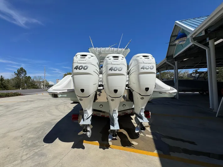  Yacht Photos Pics 2019 Fountain 39 NX boat with triple 400 horsepower engines, parked outdoors.