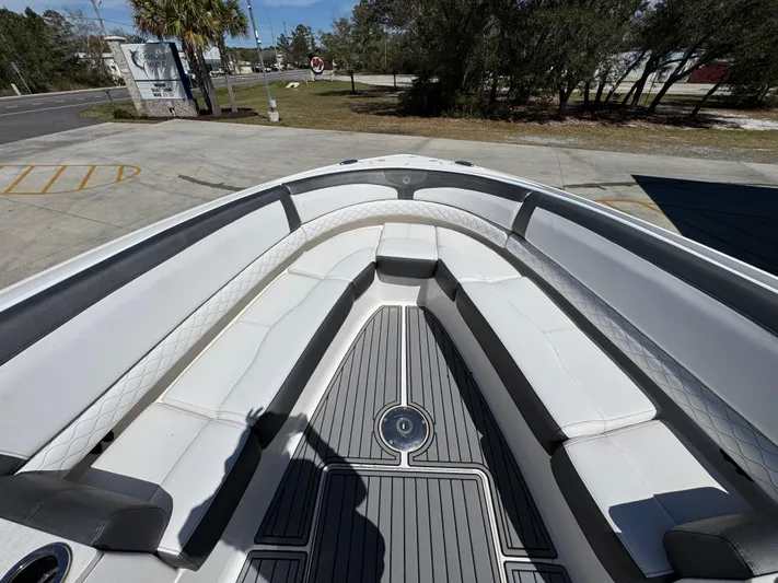  Yacht Photos Pics 2019 Fountain 39 NX boat with spacious seating and sleek design, docked outdoors.