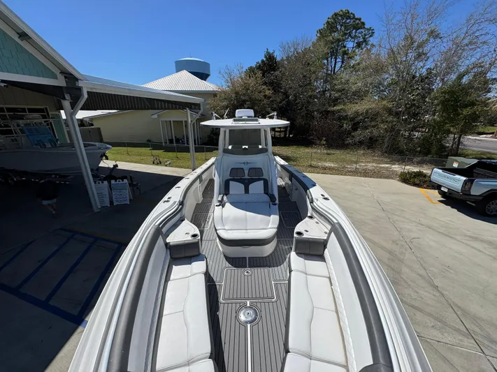  Yacht Photos Pics 2019 Fountain 39 NX boat with sleek design, docked outdoors under clear blue sky.