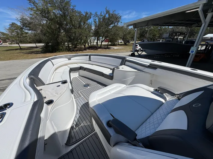  Yacht Photos Pics 2019 Fountain 39 NX boat with spacious seating and sleek design under clear blue sky.