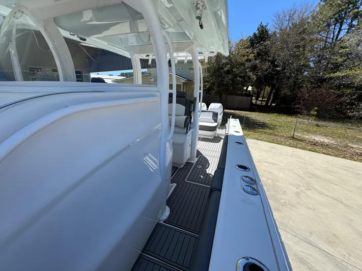  Yacht Photos Pics 2019 Fountain 39 NX boat, sleek white design, spacious deck, outdoor setting.