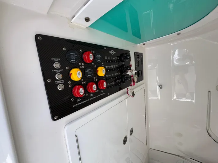  Yacht Photos Pics Control panel of a 2019 Fountain 39 NX boat with switches and buttons.