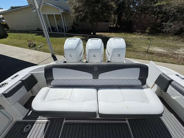  Yacht Photos Pics 2019 Fountain 39 NX boat with triple outboard engines and cushioned seating.