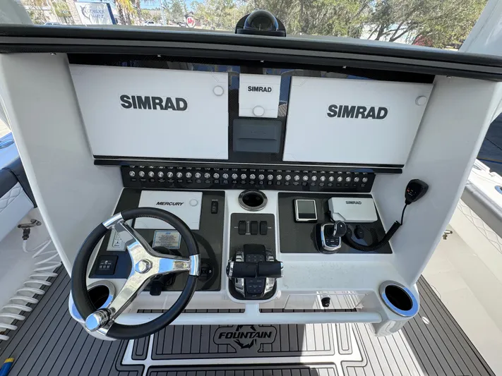  Yacht Photos Pics 2019 Fountain 39 NX boat dashboard with Simrad displays and Mercury controls.