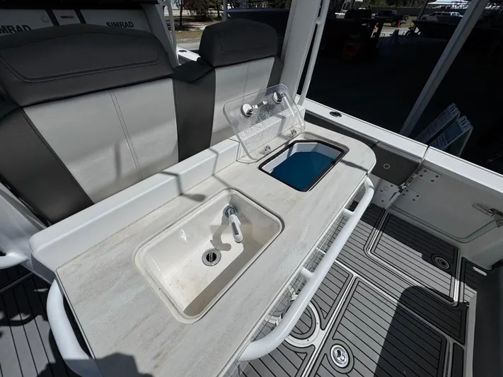  Yacht Photos Pics 2019 Fountain 39 NX boat interior with sink and seating area.
