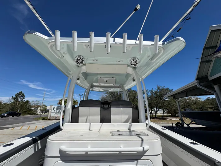  Yacht Photos Pics 2019 Fountain 39 NX boat with rod holders and seating, under a clear blue sky.