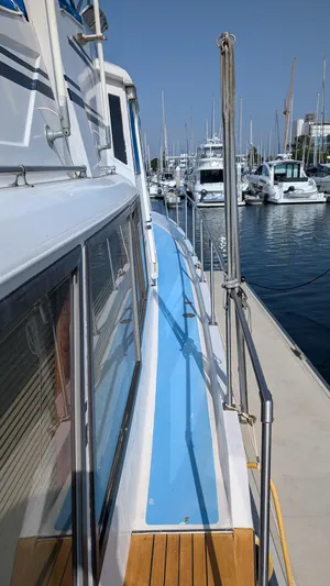 Guadalupe Yacht Photos Pics 1989 Ditmar & Donaldson Custom Cruiser docked at marina, side view.