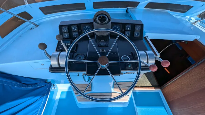 Guadalupe Yacht Photos Pics 1989 Ditmar & Donaldson Custom Cruiser helm with steering wheel and control panel.