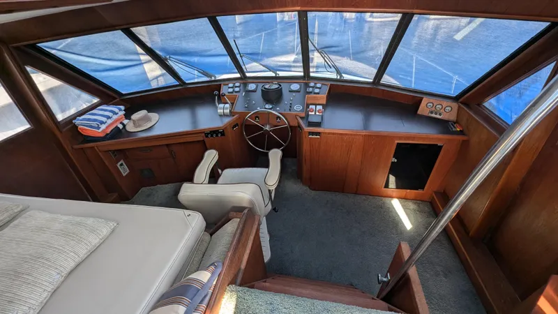 Guadalupe Yacht Photos Pics 1989 Ditmar & Donaldson Custom Cruiser interior with helm, seating, and nautical decor.