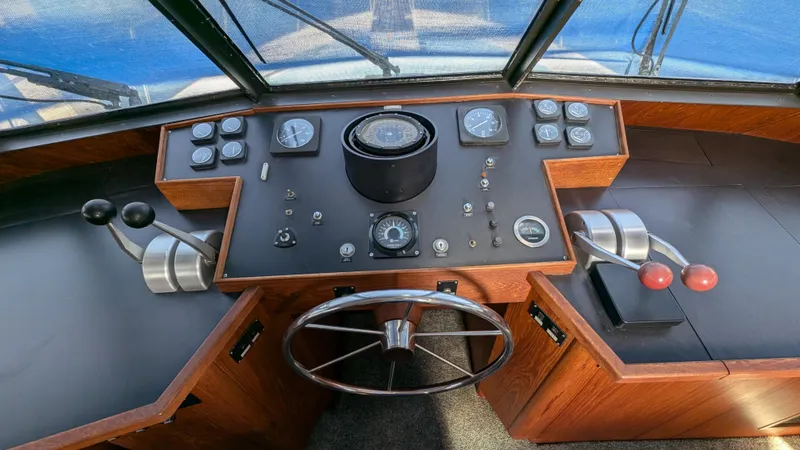 Guadalupe Yacht Photos Pics 1989 Ditmar & Donaldson Custom Cruiser helm with gauges, controls, and steering wheel.