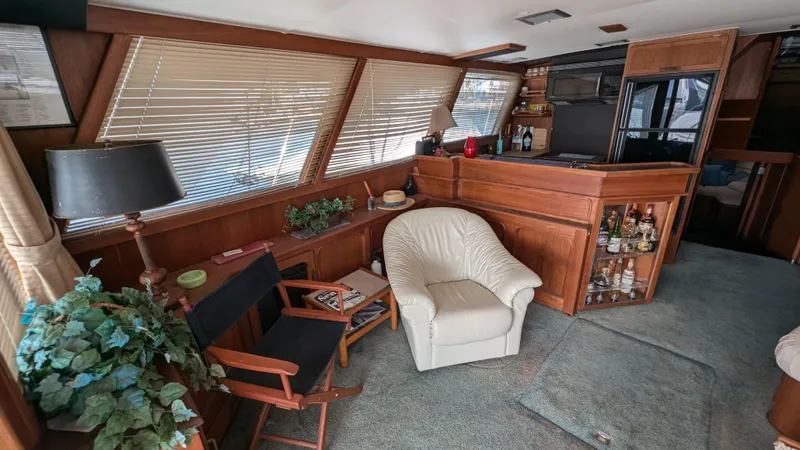 Guadalupe Yacht Photos Pics Cozy 1989 Ditmar & Donaldson Custom Cruiser interior with wood paneling and comfortable seating.