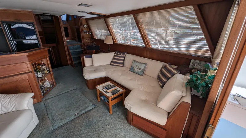 Guadalupe Yacht Photos Pics Luxurious 1989 Ditmar & Donaldson Custom Cruiser interior with plush seating and wooden accents.