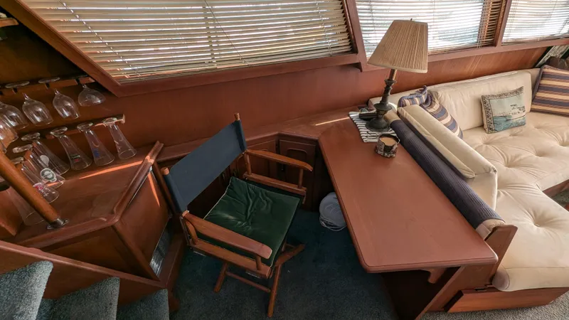 Guadalupe Yacht Photos Pics Interior of 1989 Ditmar & Donaldson Custom Cruiser with cozy seating and wooden furnishings.