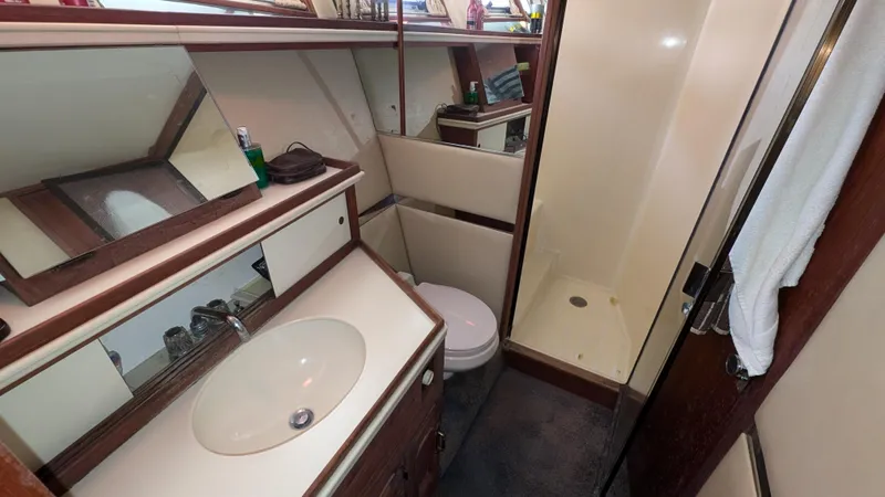 Guadalupe Yacht Photos Pics 1989 Ditmar & Donaldson Custom Cruiser bathroom with sink, toilet, and shower.
