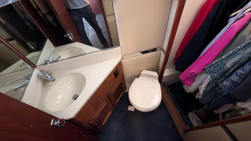 Guadalupe Yacht Photos Pics 1989 Ditmar & Donaldson Custom Cruiser bathroom with sink, toilet, and closet space.