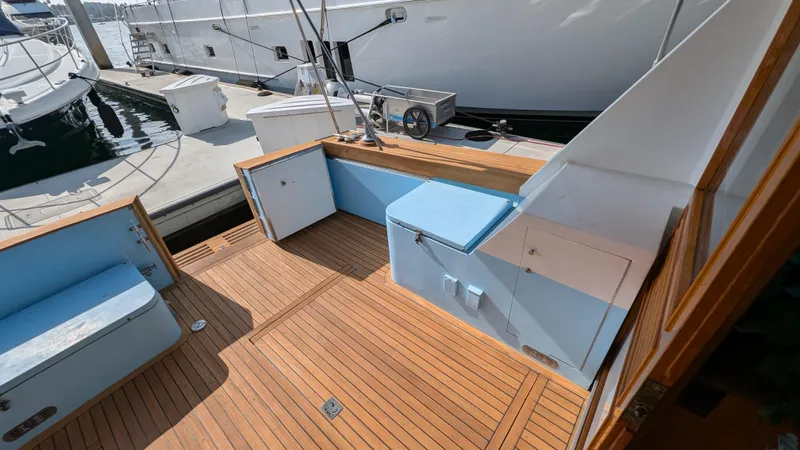 Guadalupe Yacht Photos Pics 1989 Ditmar & Donaldson Custom Cruiser with teak deck and seating at marina.