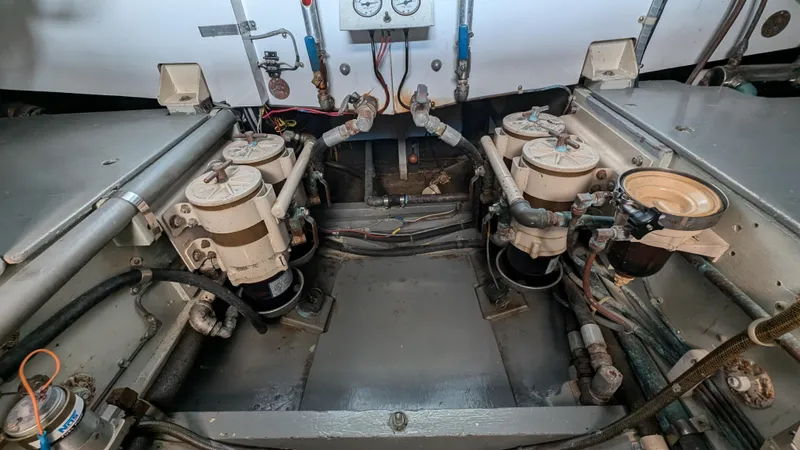 Guadalupe Yacht Photos Pics Engine room of 1989 Ditmar & Donaldson Custom Cruiser with mechanical components and gauges.