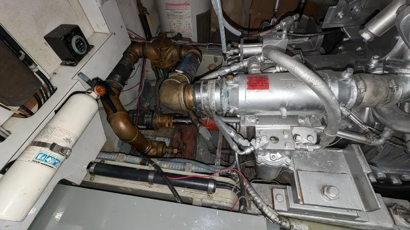 Guadalupe Yacht Photos Pics Engine compartment of 1989 Ditmar & Donaldson Custom Cruiser with visible pipes and components.
