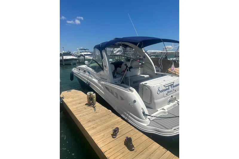  Yacht Photos Pics 2006 Sea Ray 340 Sundancer docked under clear blue sky.