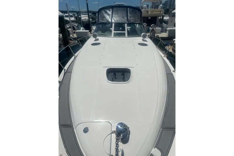  Yacht Photos Pics 2006 Sea Ray 340 Sundancer yacht docked at marina, viewed from bow.