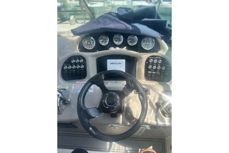  Yacht Photos Pics Helm of 2006 Sea Ray 340 Sundancer with steering wheel and control panel.