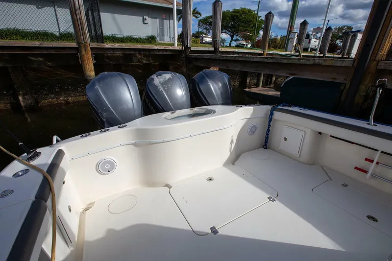 Evil Tequila Yacht Photos Pics 2015 Yellowfin 39 Offshore boat with triple outboard engines docked at marina.