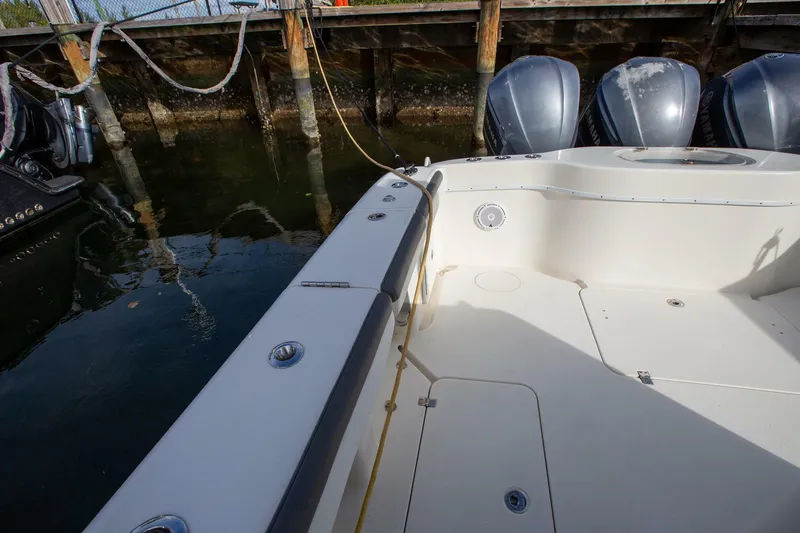 Evil Tequila Yacht Photos Pics 2015 Yellowfin 39 Offshore boat docked, featuring spacious deck and powerful engines.