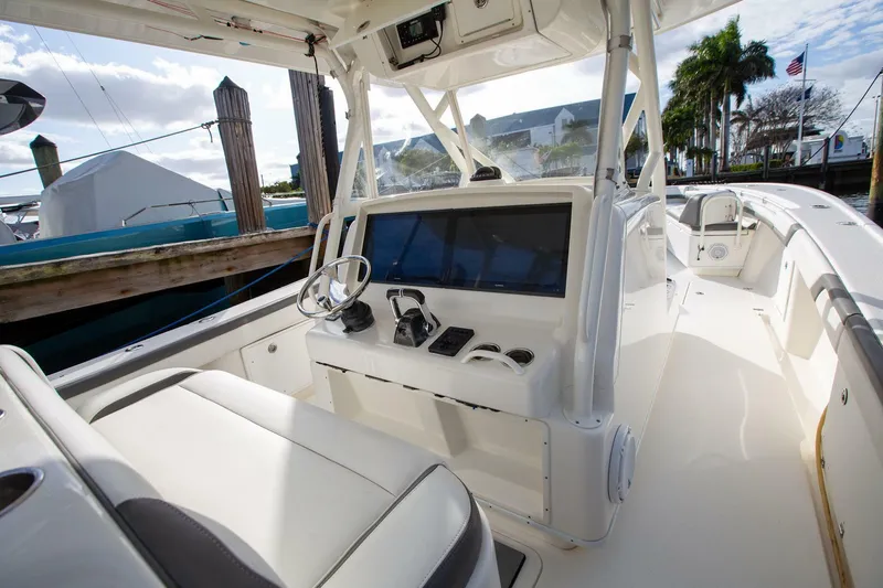 Evil Tequila Yacht Photos Pics 2015 Yellowfin 39 Offshore boat interior with helm and seating area.