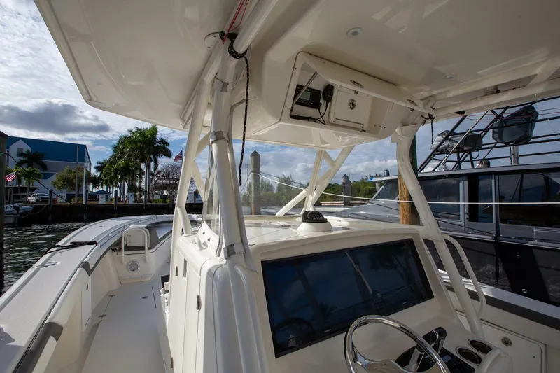 Evil Tequila Yacht Photos Pics 2015 Yellowfin 39 Offshore boat interior with steering console and navigation equipment.