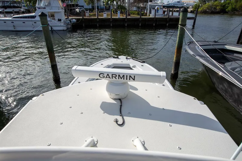 Evil Tequila Yacht Photos Pics 2015 Yellowfin 39 Offshore boat with Garmin radar, docked in a marina.