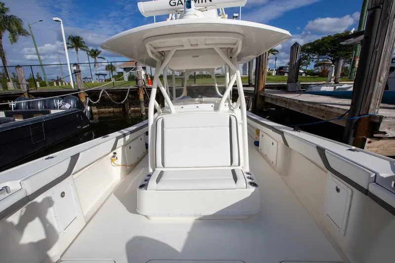 Evil Tequila Yacht Photos Pics 2015 Yellowfin 39 Offshore boat with spacious deck and seating, docked under clear skies.
