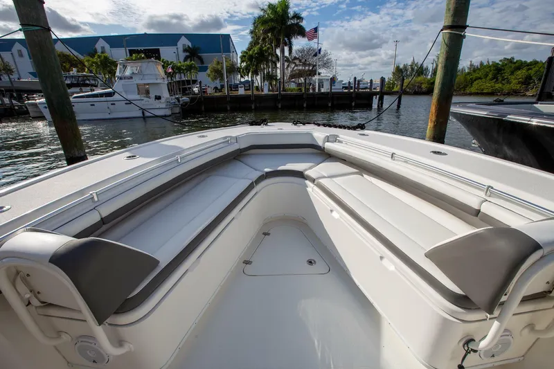 Evil Tequila Yacht Photos Pics 2015 Yellowfin 39 Offshore boat with spacious seating, docked at a marina.