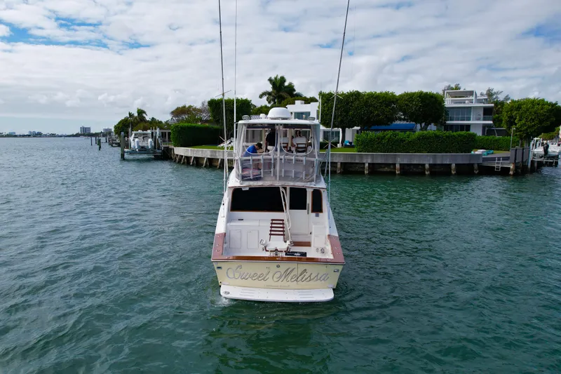 Sweet Melissa Yacht Photos Pics 1992 Ocean Yachts 48 Super Sport on water near waterfront homes.
