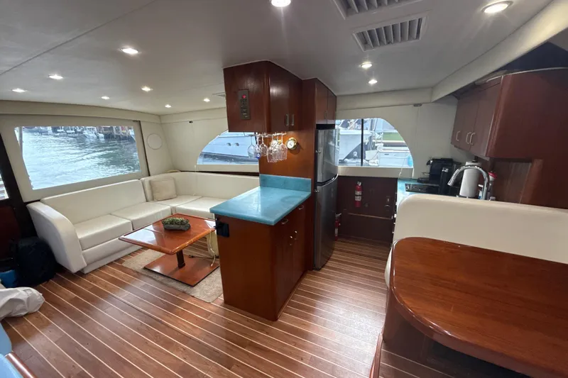 Sweet Melissa Yacht Photos Pics Luxurious interior of 1992 Ocean Yachts 48 Super Sport with modern kitchen and seating area.