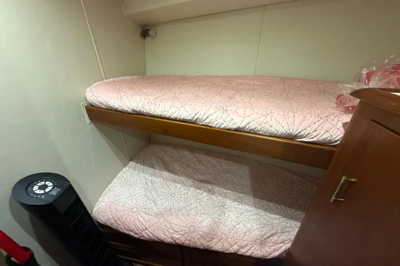 Sweet Melissa Yacht Photos Pics Bunk beds in 1992 Ocean Yachts 48 Super Sport cabin with pink bedding.