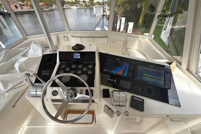 Sweet Melissa Yacht Photos Pics Helm of 1992 Ocean Yachts 48 Super Sport with navigation equipment and steering wheel.