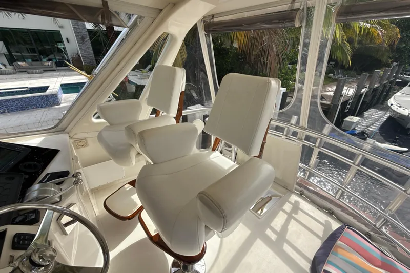 Sweet Melissa Yacht Photos Pics Interior of 1992 Ocean Yachts 48 Super Sport with white captain's chairs and helm.