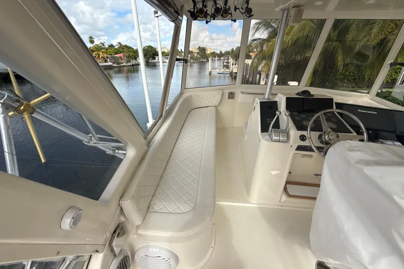 Sweet Melissa Yacht Photos Pics Interior view of 1992 Ocean Yachts 48 Super Sport, featuring helm and seating area.