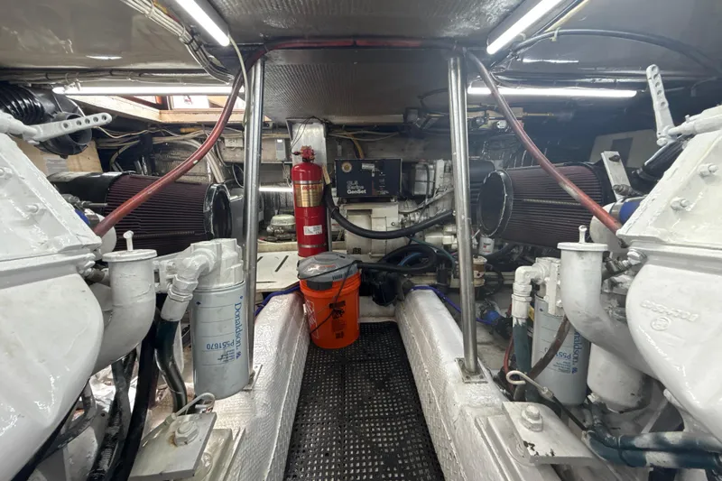 Sweet Melissa Yacht Photos Pics Engine room of 1992 Ocean Yachts 48 Super Sport with visible machinery and equipment.