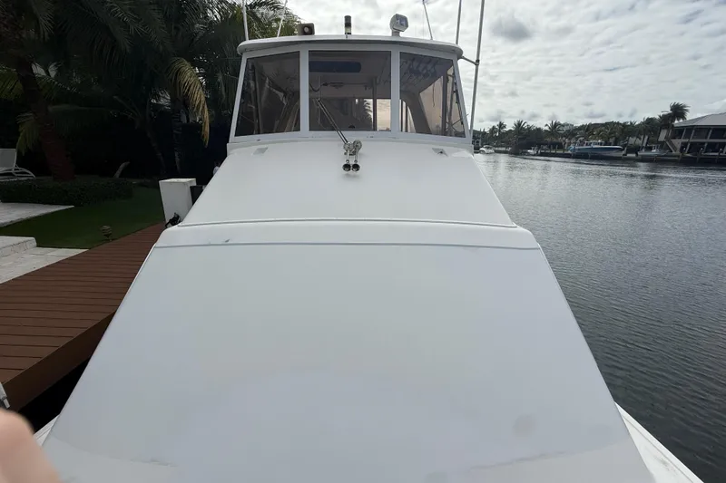 Sweet Melissa Yacht Photos Pics 1992 Ocean Yachts 48 Super Sport on calm water, dockside view.
