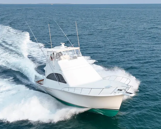 Wrangler Yacht Photos Pics 2008 Ocean Yachts 54 Super Sport cruising on open sea, creating waves.