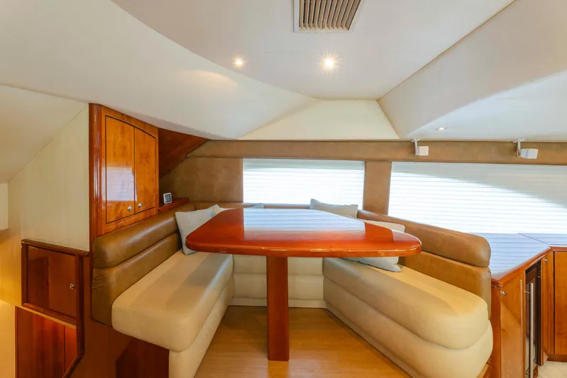 Wrangler Yacht Photos Pics Luxurious dining area in 2008 Ocean Yachts 54 Super Sport, featuring elegant wood finishes.