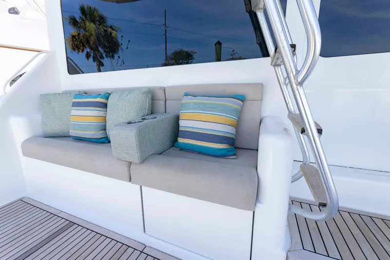 Wrangler Yacht Photos Pics Luxury seating area on 2008 Ocean Yachts 54 Super Sport with striped cushions.