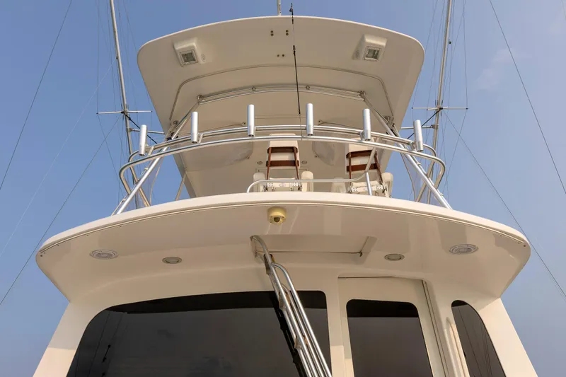 Wrangler Yacht Photos Pics 2008 Ocean Yachts 54 Super Sport, view of upper deck and tower against blue sky.