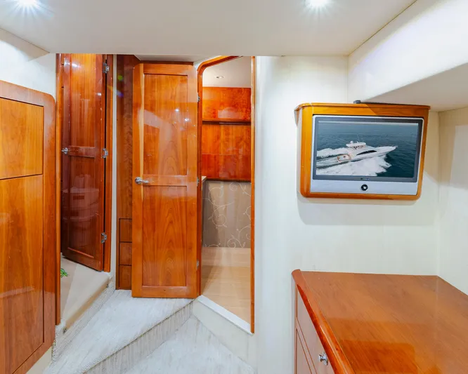 Wrangler Yacht Photos Pics Luxurious interior of 2008 Ocean Yachts 54 Super Sport with wood finishes and TV display.